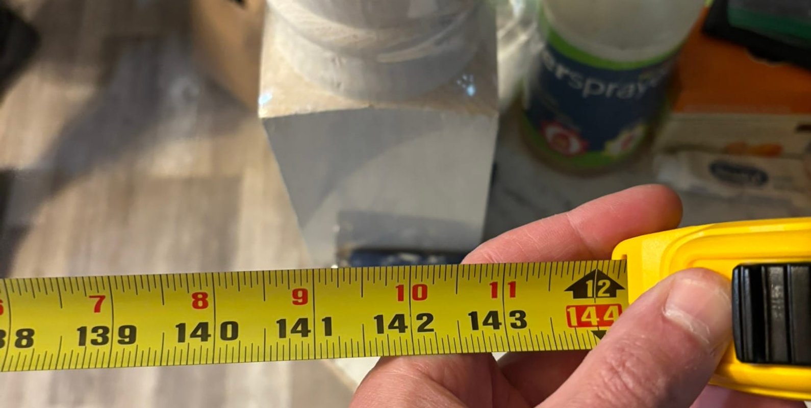 Temporary shoring installed and measured after load-bearing wall removal—an essential step in stabilizing the structure before engineering a permanent beam solution.