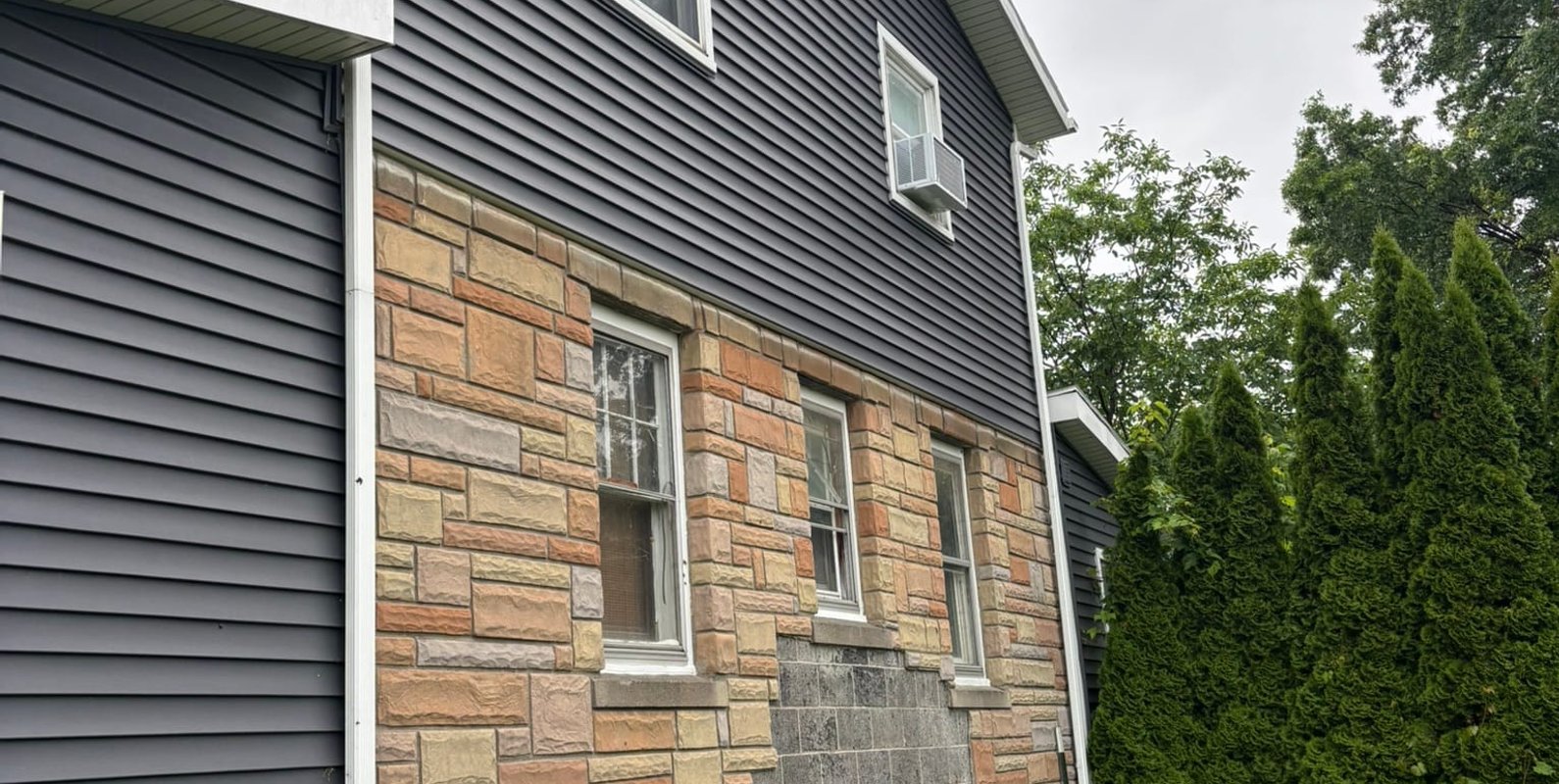 Existing side of home identified as the preferred location for a future two-story addition containing new living space and an additional bedroom.