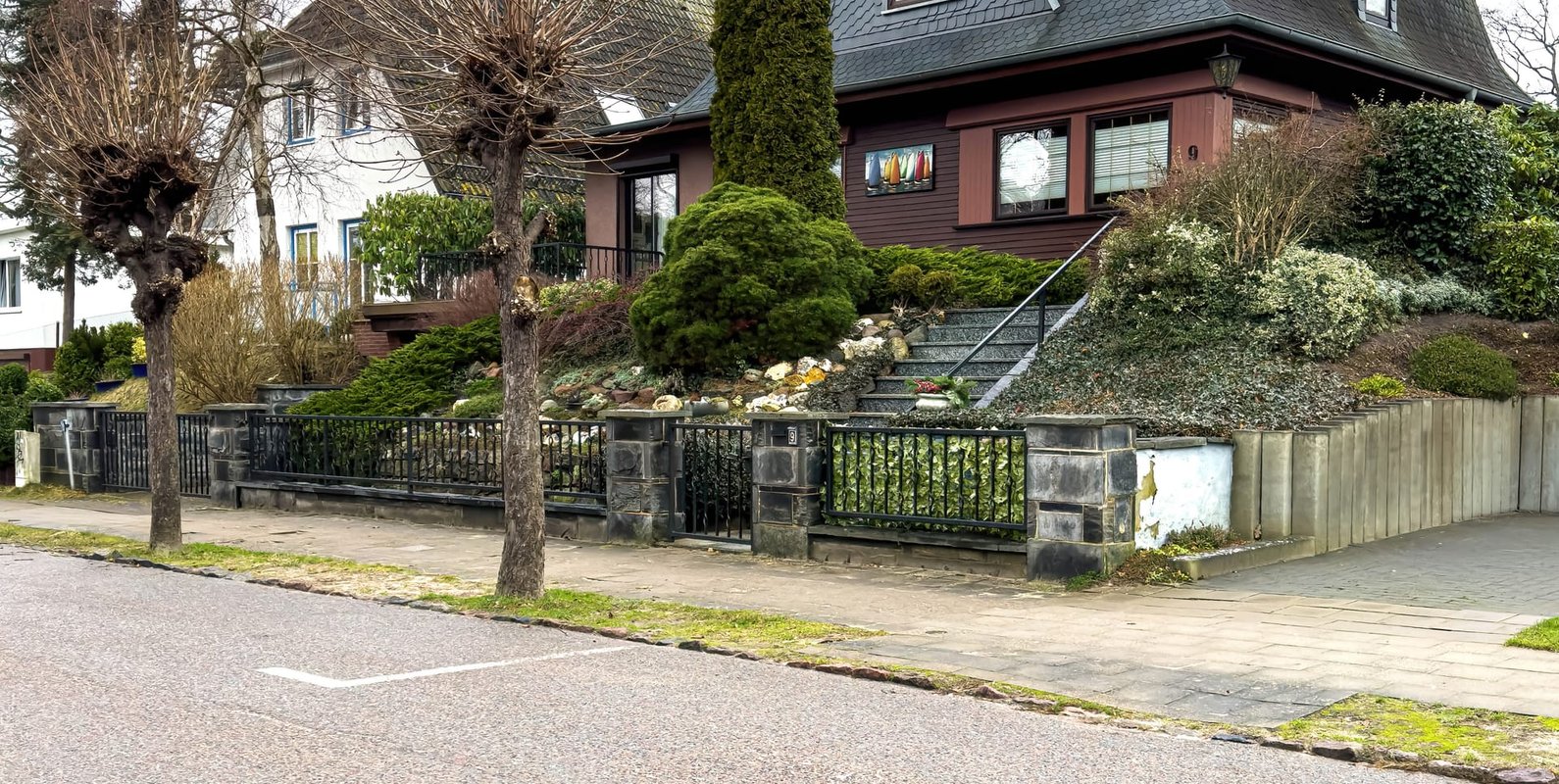 Residential property featuring a steep tile-style roof and raised foundation. A common assessment during a pre-purchase engineering inspection.